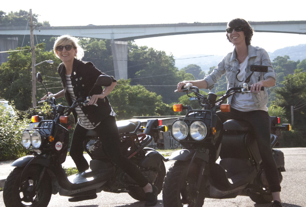 Vanessa Veltre, left, and Carrie Battle on their Honda Ruckuses in Bloomfield. Photo by Fred Blauth.